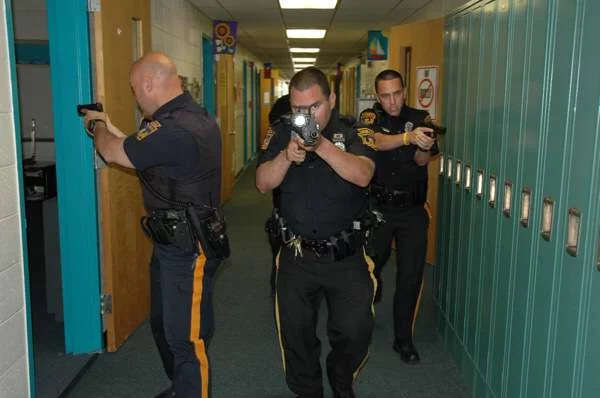 Clearing a school by LMTPD for an active shooter